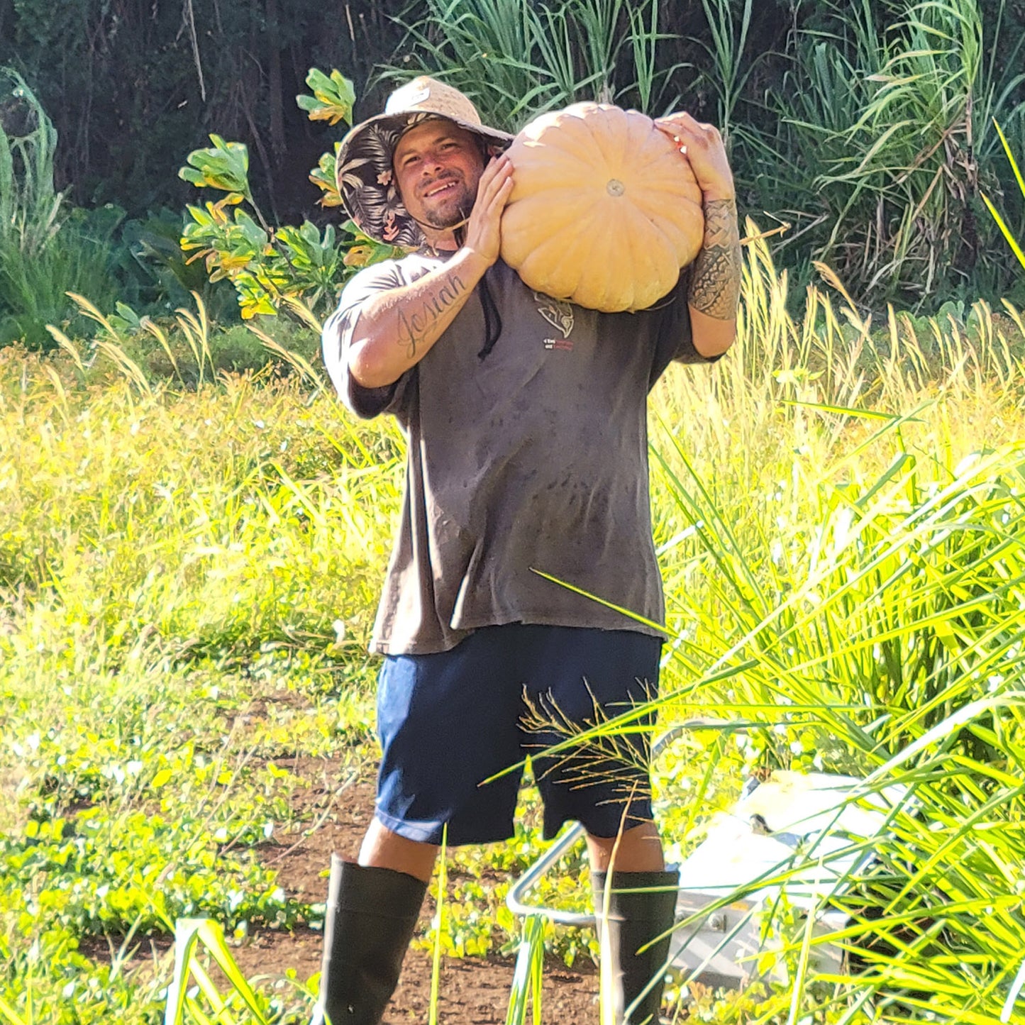 farmer Anthony holding a large Yoeme Segualca squash