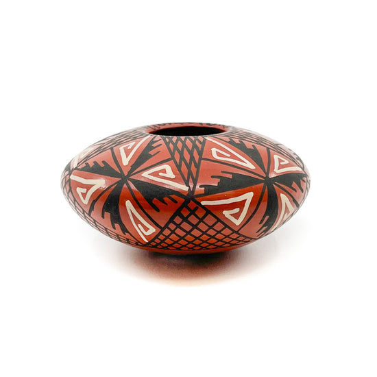 White and Black Geometric Designs on Red Clay