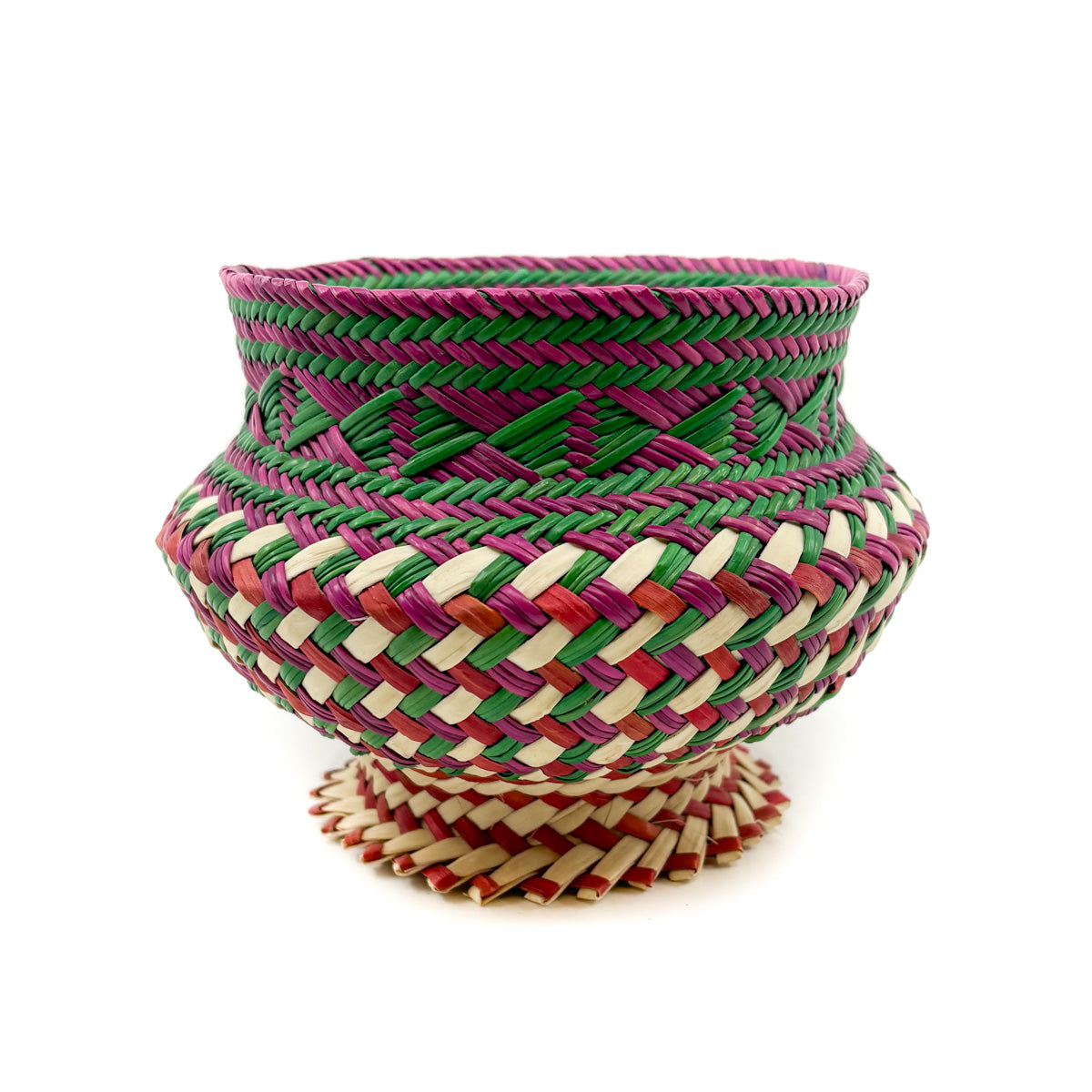 Colorful woven basket with geometric patterns on a white background