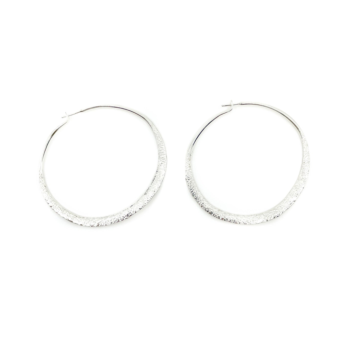 Sterling silver hand hammered and textured, wavy hoop earrings by Elgin Tom Sterling silver posts  Approximate dimensions: Hoops are 2.25 inches in diameter and just shy of 1/4 of an inch wide at widest flat area on bottom of hoop