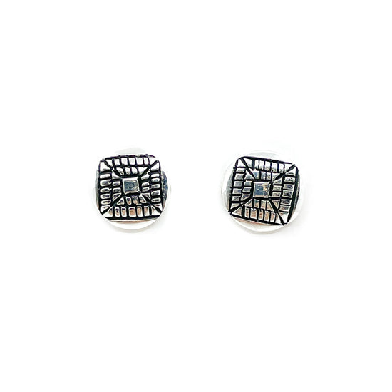 Diné silversmith Elgin Tom, hand stamped stud earrings Measures 3/8 inch in diameter, sterling silver posts and backs Classic look, goes with everything!