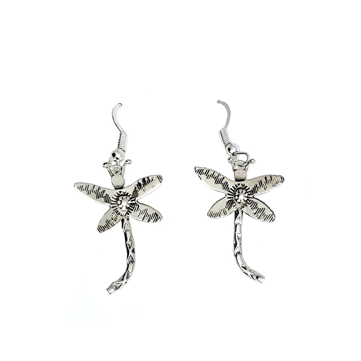 Sterling silver small dragonfly earrings with sterling silver ear wires These delicate earrings are hand stamped and measure approx. 1 inch long, they dangle approx. 1.50 inches from earlobe By Diné silversmith Lucille Platero