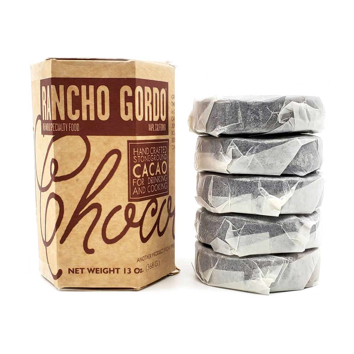Grown, roasted and ground by the&nbsp;Mujeres de Xochis Collective in Guerrero, Mexico using local cacao and evaporated cane juice (piloncillo). The chocolate beans are roasted on clay pans before being stoneground with soft cinnamon (canela). Ideal for hot cocoa, grated over oatmeal, in baked goods, or for making mole For delicious hot cocoa, break discs into pieces and whisk into hot milk as it dissolves. (A blender works, too!) Use 2 discs per liter of milk or water 13 ounce box of 5 individually wrapped